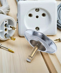 Rotary Bathtub Drain Stopper Copper One Press Seal Hair Catcher on wooden surface with electrical components.