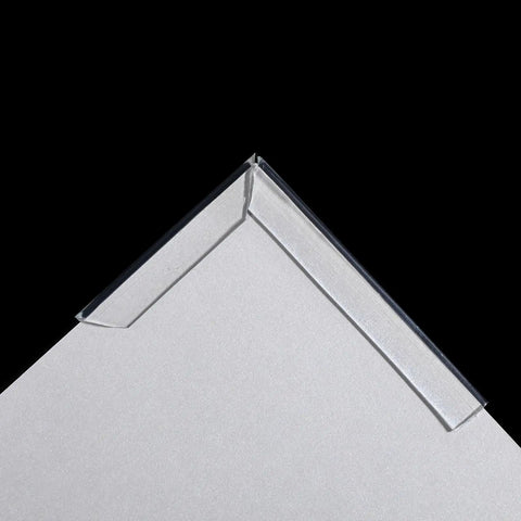 Genuine Clear U Channel Edge Trim Runs A Solid 13 Feet Long With Bendy Construction protecting a corner of a tabletop.