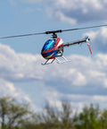 Fusion 700 Kit High Performance Super Combo flying with carbon fiber 700mm main rotor and 105mm tail blades in open sky