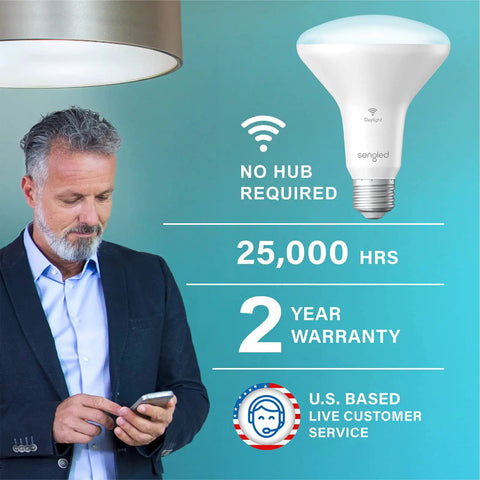 Man using phone next to BR30 Smart Flood Light Bulbs With WiFi No Hub Needed 650 Lumen Daylight 60W Equivalent E26 Base