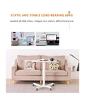 Built Different Overbed Table With Adjustable Height For Bedside Care And Work From Home Vibes Smooth Locking Casters, shown in home setting near a sofa.