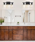 Three Light Black Vanity Light Fixtures With Clear Glass Shades in bathroom over wooden cabinets and mirror, E26 Base