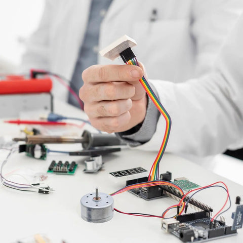 Tiny 5V DC Motor 6000 RPM With Wire Pack Of 3 For DIY Toys And Experiments, ideal for STEM projects on a budget, shown on workspace.