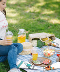 Picnic setting with Set Of 6 Camping Kitchen Towels, 24 X 16 Inches, White Absorbent Dishcloths on blanket with food and drinks.