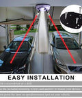 Dual Laser Garage Parking Sensor With AC Adapter And 360 Degree Adjustable Arms projecting lasers in a garage for parking assistance.