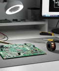 Two Pack 0.1mm Enameled Copper Solder Wire for PCB and Cell Phone Motherboard Repair next to a circuit board on a desk