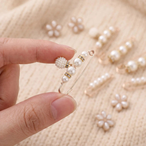 Premium Pearl Waist Adjustment Clips For Baggy Pants No Sew Button Fasteners in hand against a soft background.
