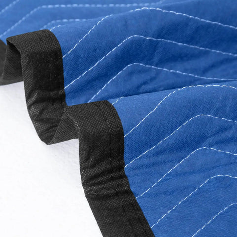 Close-up of Ultra Large 80 By 72 Inch Moving Blankets 12 Pack Beefy Heavy Duty Furniture Pads showing blue and black quilted fabric.