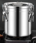 Heavyweight 304 Stainless Steel Food Storage Containers With Airtight Lids on a stove, ideal for keeping kitchen stash fresh.
