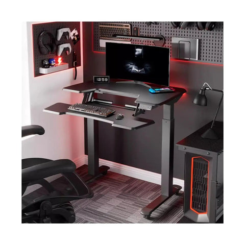 Level Up Your Workspace With This Electric Rolling Standing Desk Featuring Rapid Dual Motor Height Memory Settings Pro Grade Double Layer Gaming Top And Swivel Casters For Stress Free Office Flex, black and grey with monitor and keyboard setup.