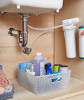 Universal 10 Inch Under Sink Water Filter Replacement, Single Stage Filtration, cartridge being installed in system