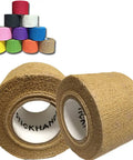 Premium Non Slip Drumstick Grip Tape Two Pack Tan Soft Cotton Gauze Roll shown in foreground with colorful rolls behind.