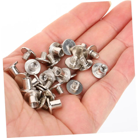 Built Tough Chicago Style Binding Screws For Books And Scrapbooks And Paper Crafts Using 75 Piece Silver Carbon Steel Fasteners in hand.