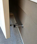 Heavy Duty Zinc Alloy Door Stopper With Hanging Hook securing a door open while protecting walls from damage.