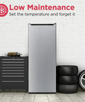 Seven Cubic Foot Convertible Upright Fridge Freezer Real Deal Smooth Operator With Click To Switch Dual Temp Modes For Garage Kitchen Or Dorm Room Built Tough next to tool chest and tires.