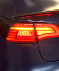Knight Rider Led Tail Light Upgrade Kit For Model 3 And Model Y Plug And Play Rear Lamps In Flame Design illuminating red with sleek housing.