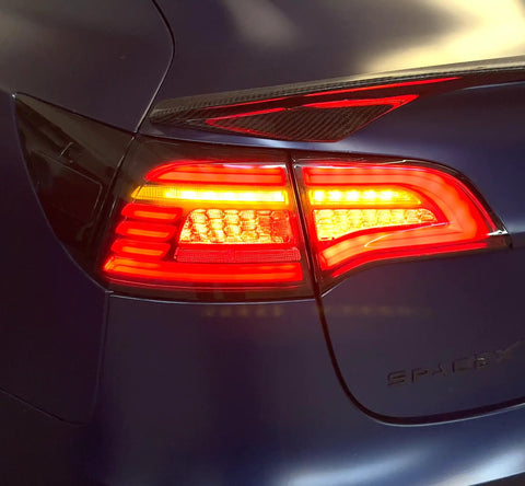 Knight Rider Led Tail Light Upgrade Kit For Model 3 And Model Y Plug And Play Rear Lamps In Flame Design illuminating red with sleek housing.