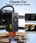 ORTUR Laser Master 2 S2 LU2-10A laser engraver with black housing; blue laser engraving on wood.