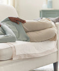 Person resting on sofa with Heavy Absorbency Underpads 30 x 36 Inches Disposable Bed Pads 100 Count For Incontinence, Ultra Protection