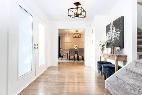 Vintage Industrial 4 Light Semi Flush Mount Ceiling Lantern in matte black for foyer living room and dining room visible from hallway.