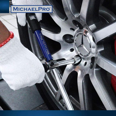 2-In-1 Lug Wrench And Torque Wrench, 1/2 Inch Drive With Sockets, used on car tire rim by gloved hand