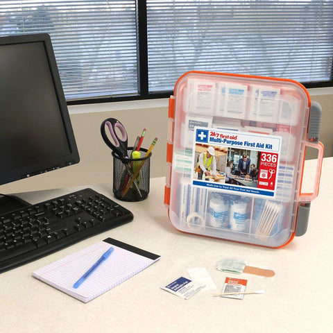 Front view of 24/7 multi-purpose first aid kit in orange-trimmed clear plastic case, 336 pieces