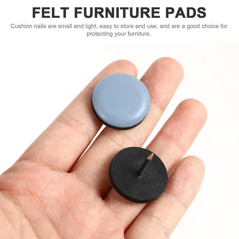 Close-up of hand holding 16 Pack Furniture Sliders With PTFE Iron Floor Protectors for hardwood tile and linoleum floors