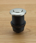 Touch Activated Garbage Disposal Air Switch Kit with Base Unit on wooden surface