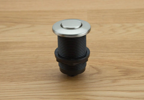 Touch Activated Garbage Disposal Air Switch Kit with Base Unit on wooden surface