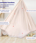 Kids Sensory Swing Chair For Indoor And Outdoor Chill, Cuddle Hammock Therapy Seat hanging in a room, silky fabric stretched.