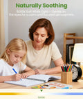 Mother and daughter studying under natural light with a lamp; 5000K soft white light creating a soothing atmosphere.
