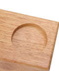 Sweet Beech Wood Coffee Tamper Stand With Clever Side Nook Securely Stores 51 To 58 Mm Tools close-up view of circular indentations.