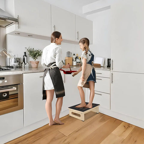Woman and child in kitchen using sturdy wooden step stool for adults and seniors with non slip rubber tread, 5.5 inch rise