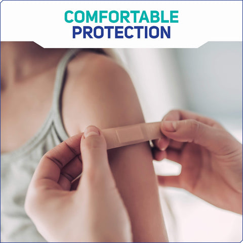 Applying Fabric Adhesive Bandages 200 Count Bulk Assorted Sizes With Flexible Breathable Protection on arm for first aid