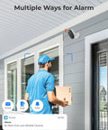 Person standing near home entrance with 1080p Outdoor Security Camera System 2 Pack With WiFi Plug In Color Night Vision And Built In Spotlight