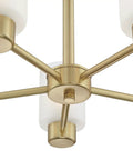 Close-up of Five Light Indoor Chandelier in champagne brass finish with frosted glass, focusing on central hub design.