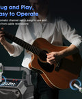 Person playing guitar with Wireless Microphone System With XLR Transmitter And Receiver UHF 262 Foot Range 8 Hour Battery for performance.