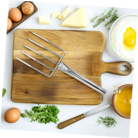 Stainless Steel Bean Sprout Fork Garden Trowel Small Digging Spade on wooden cutting board with eggs and herbs
