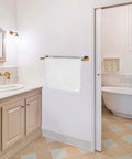 Gold Brushed 7 Piece Bathroom Accessory Kit Wall Mounted Featuring 23.62 Inch Double Towel Bar in a modern bath setting