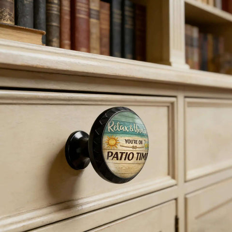 Relax And Unwind Patio Sign Cabinet Knobs 4 Pack Acrylic Round Drawer Pulls on a wooden cupboard drawer close-up