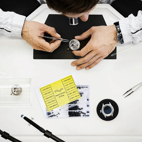 Watchmaker using Pro Grade Rubber O Rings And Seal Washers Set For Watch Repair 500 Piece Waterproof Gasket Kit.