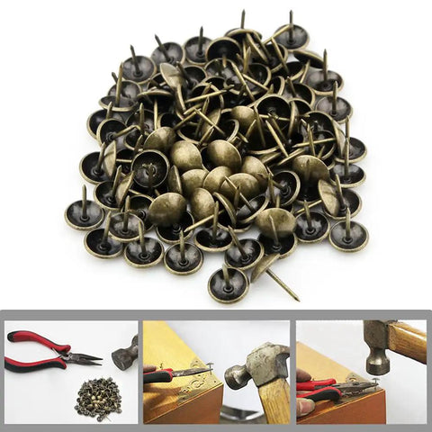 Top Shelf 100 Piece Set Of Antique Bronze Upholstery Nails And Decorative Furniture Tacks in a pile, ideal for DIY projects.