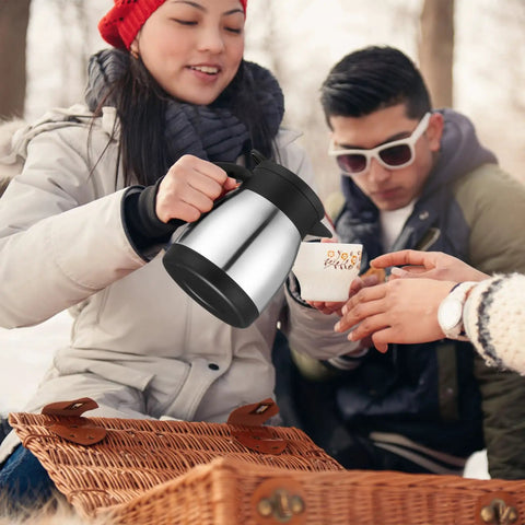 Set Of Two Heavy Duty Thermal Coffee Carafe And Creamer Pitcher In Sleek Silver Finish with double wall insulation being poured.