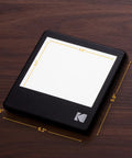 LED Light Box 5x4 Inches For Negatives, Slides And Films on wooden surface, glare-free illuminated viewing panel shown