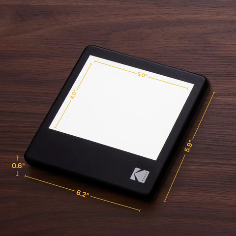 LED Light Box 5x4 Inches For Negatives, Slides And Films on wooden surface, glare-free illuminated viewing panel shown