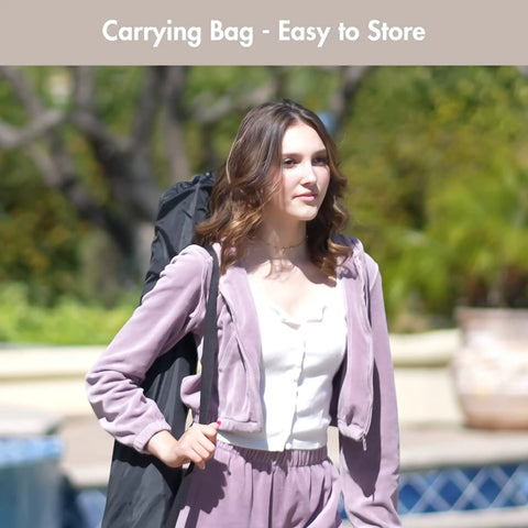 Person carrying Double Rope Hammock With Hardwood Spreader Bar And Carrying Bag 450 Lbs Capacity For Two People Durable Weather Resistant Outdoor Hammock Easy Setup For Backyard Kickback In Natural Color bag.