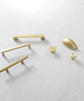 10 Pack 3-Inch Center Cabinet Handles with Brushed Brass Finish displayed on a light surface, showcasing various styles and shapes.