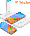 Desk Lamp With Wireless Charger And USB Port, Dimmable LED Table Light With Clock, showing charging phones on a white base.