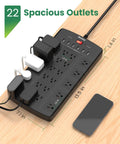 22 Outlet Power Strip Surge Protector With Six Point Five Foot Flat Plug Extension Cord on wooden desk with devices connected