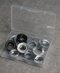 Durable Carbon Steel Bike Hub Nut And Safety Washer Kit With M8 M9.5 M10 in plastic case on gray surface